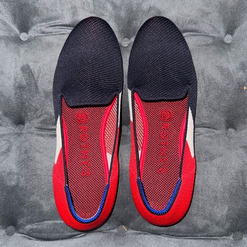 Rothy’s navy, red, and white loafers.